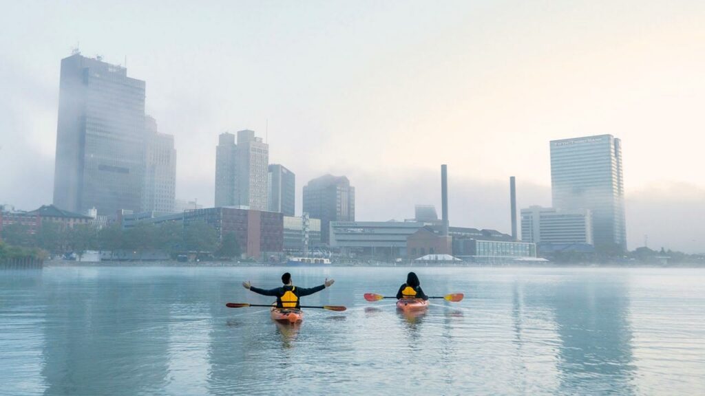Paddlers-in-Toledo Ohio with city in background