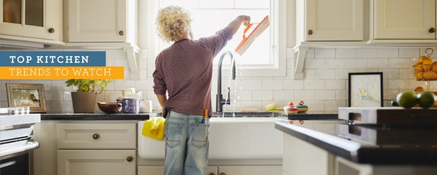 Kid standing at sink in new home kitchen