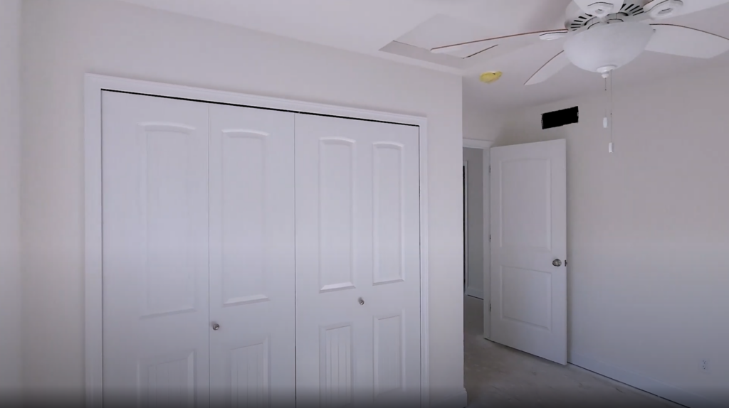 Bedroom with a wall closet.